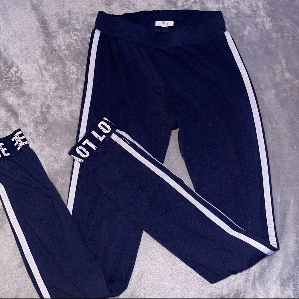 Ardene navy blue leggings with white strips and “love”writing on the ankles